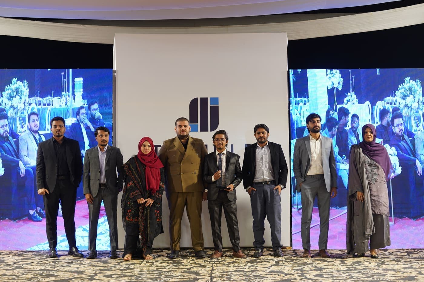 Award winners lined up on stage at the Tribuild Annual Awards 2024